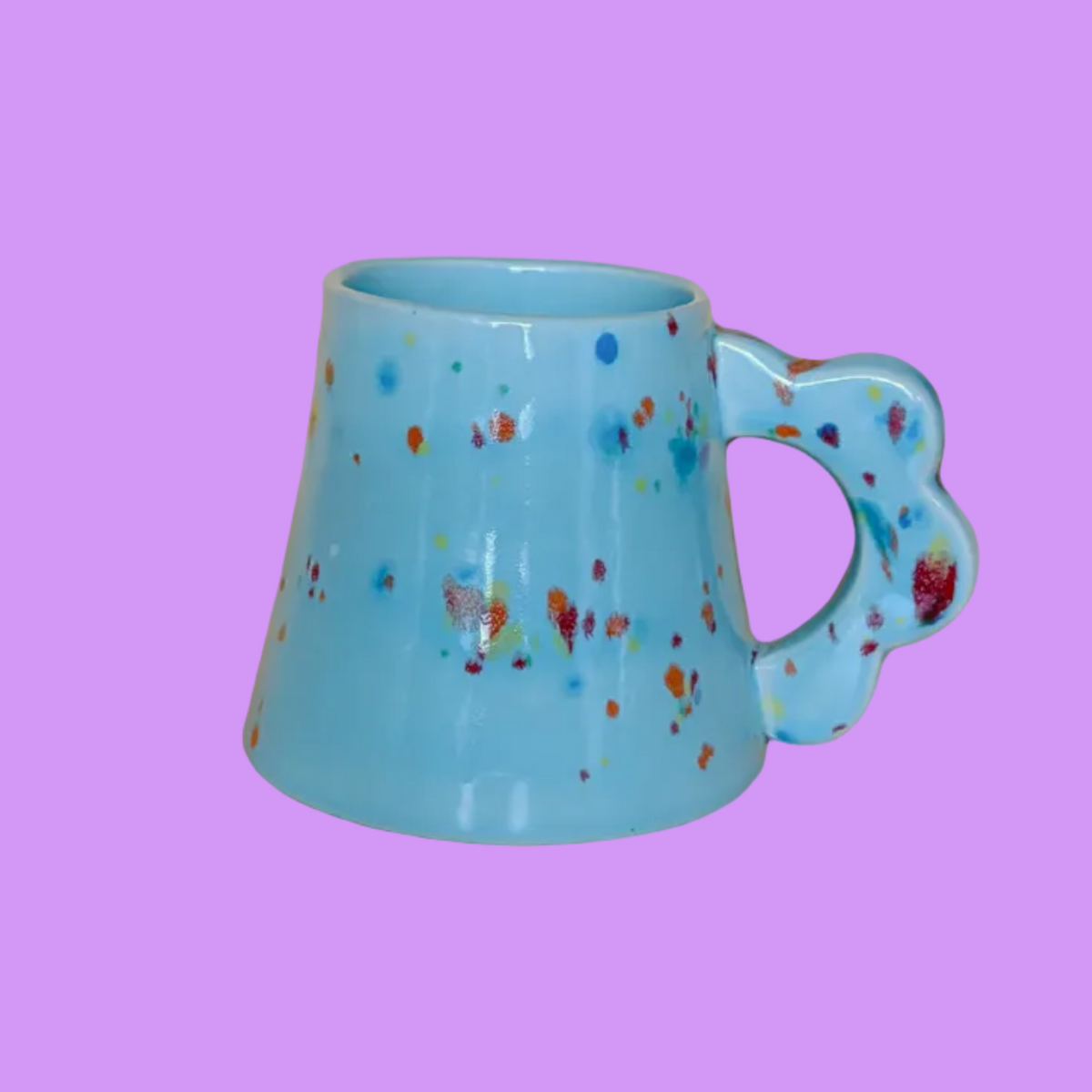 New Arrivals Snoopy heart coconut soy wax candle in glass jar beside pink striped box.