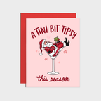 Martini Tipsy Santa Holiday Card, pink A2 card (4 1/4 x 5 1/2) with Santa lounging in a martini glass and festive text.