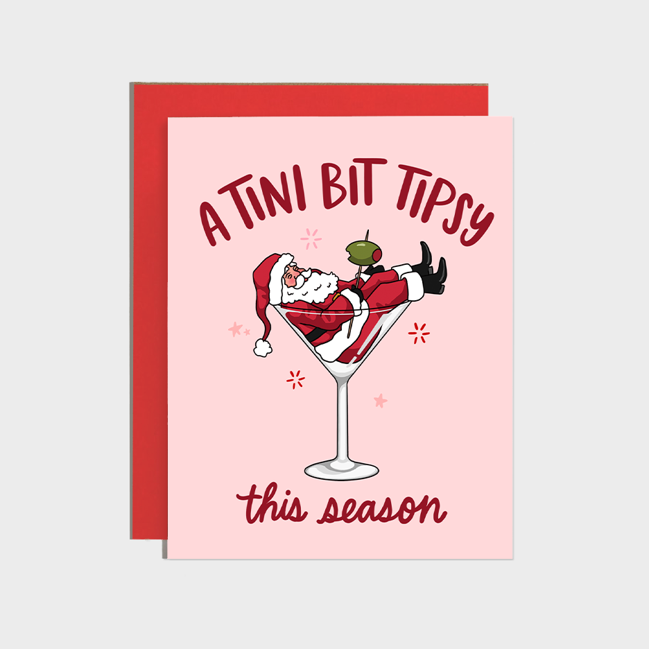 Martini Tipsy Santa Holiday Card, pink A2 card (4 1/4 x 5 1/2) with Santa lounging in a martini glass and festive text.