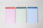 Mini Legal Pad Set: three colored pads (pink, cream, blue) with unique header phrases.