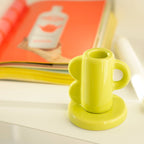 Lime Vintage Waves Candle Holder with side waves design on a round base.