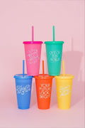 Five 24 oz color-changing tumbler set with lids and straws, each with a unique white design.